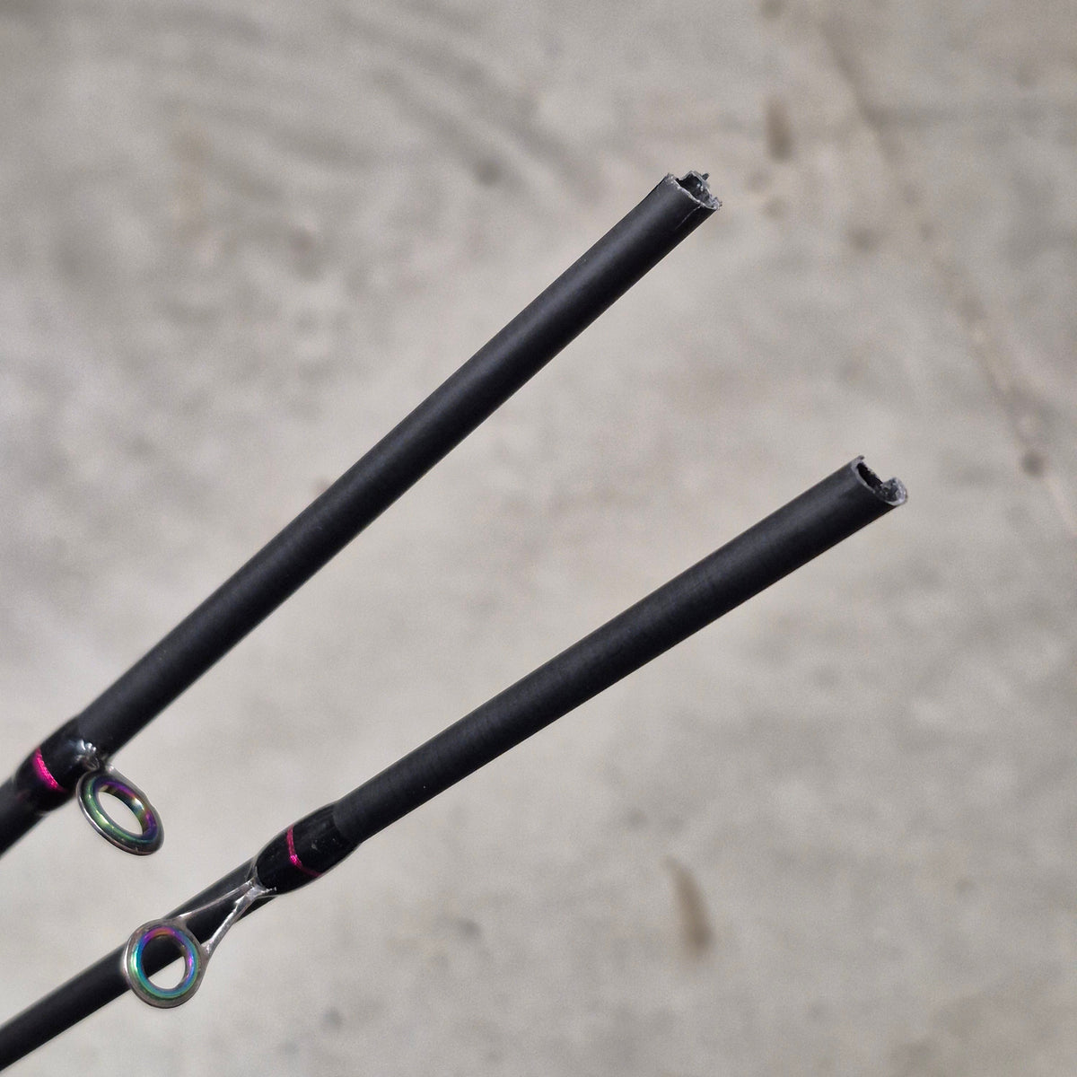 Broken fishing rods pieces on grey background