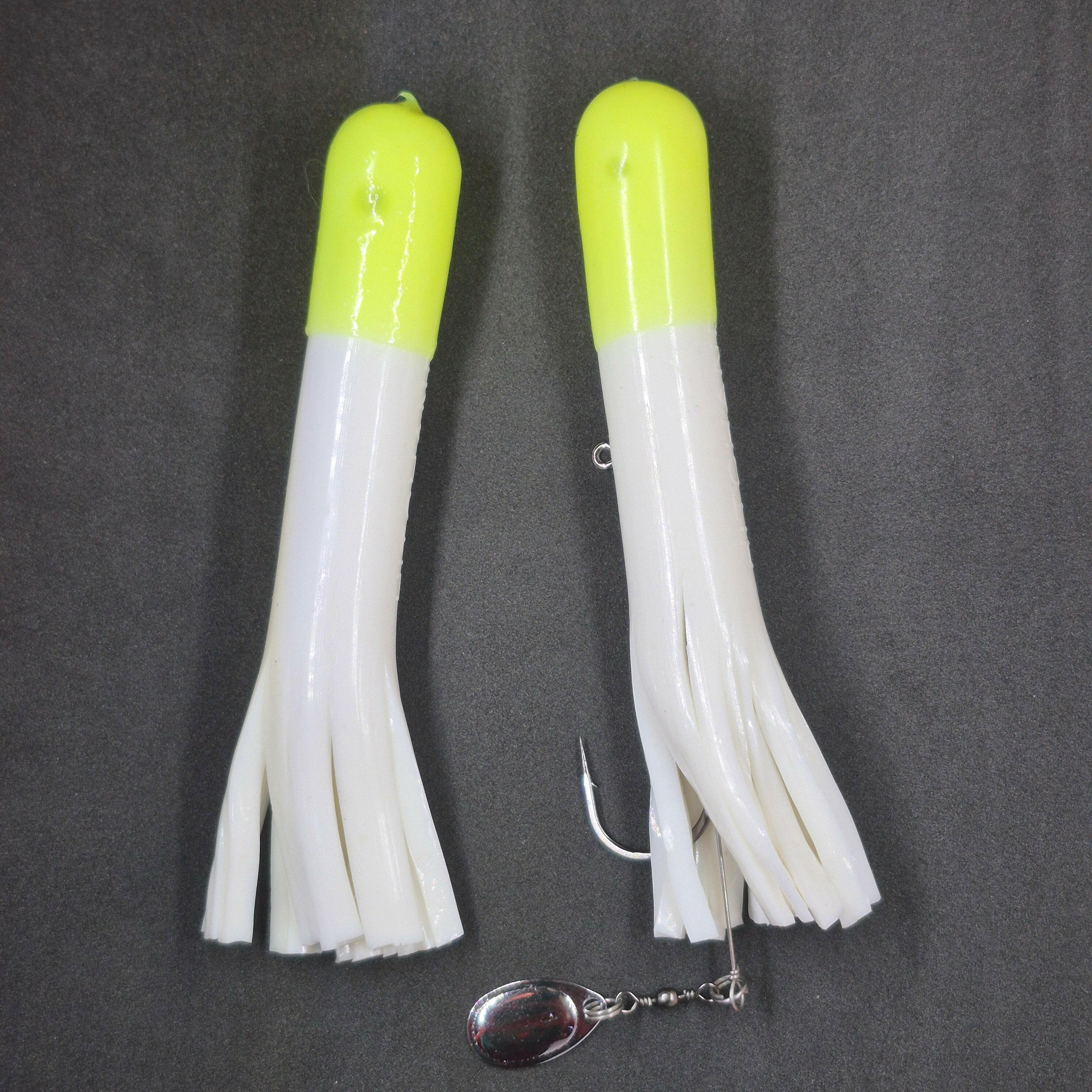 White tube jig with Chartreuse tip on black background