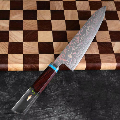 Decorative chef's knife with a wooden handle on a checkered wooden board