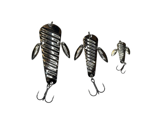 Three metallic fishing lures on a white background