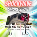 Lipless crankbait with 'Shockwave Smoke Show' and 'High Caliber Lures' text on a colorful background