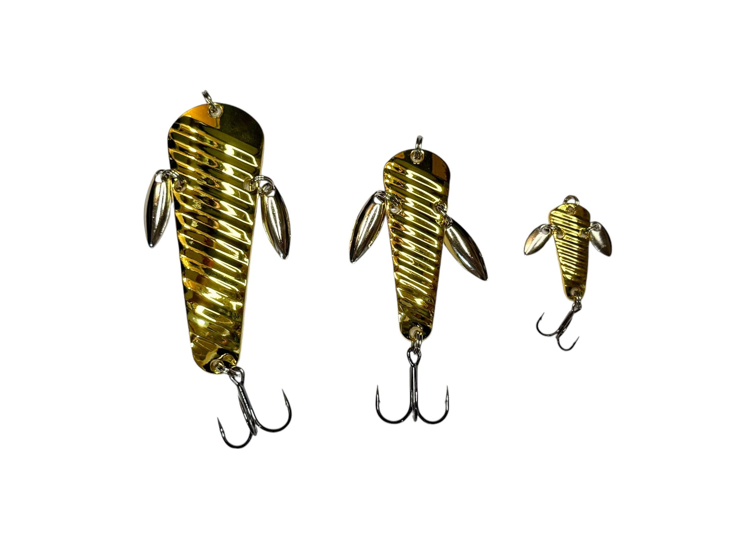 Three gold fishing lures on a white background