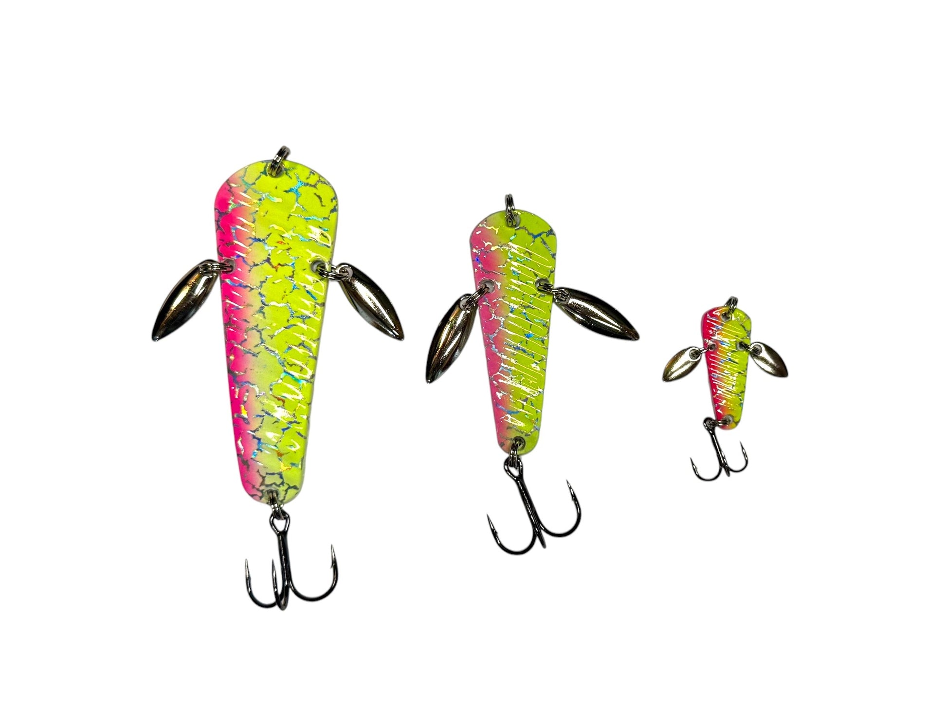 Three yellow and pink fishing lures on a white background