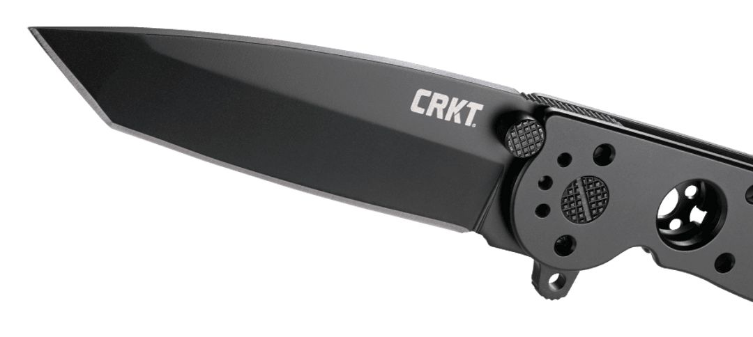 Folding knife with 'CRKT' branding on a clear background
