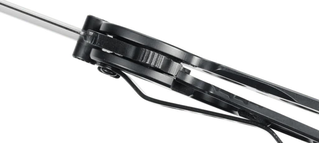 Close-up of a black metal tool with a green background