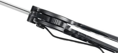 Close-up of a black metal tool with a green background