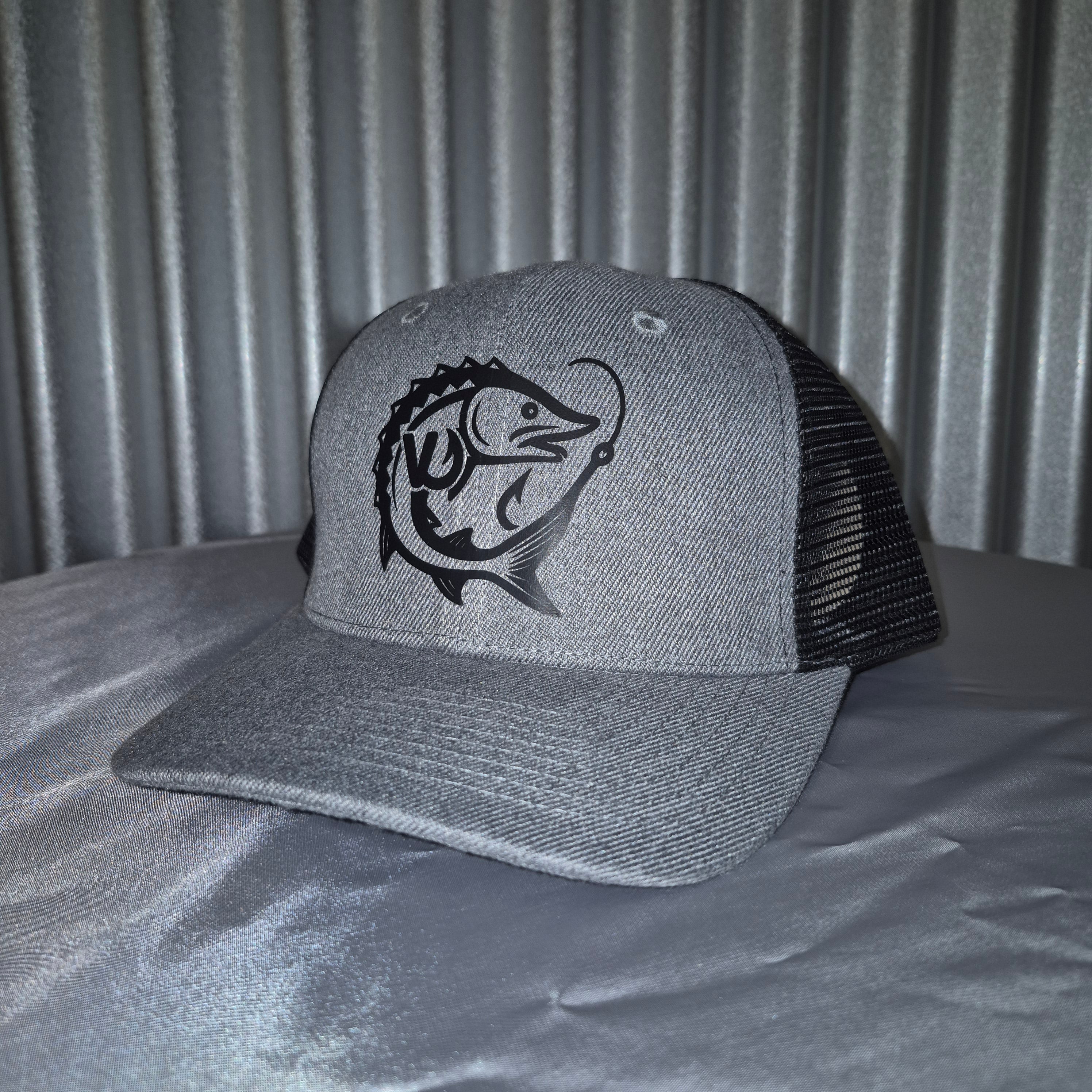 Gray hat with a black fish logo on a gray background