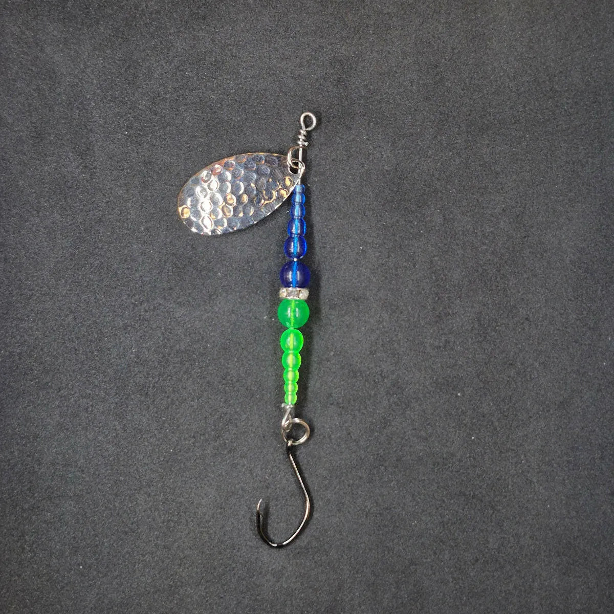 Spitfire Fishing Supermarine MK2 Wedding Ring Spinners on black background blue, chartreuse, nickel blade