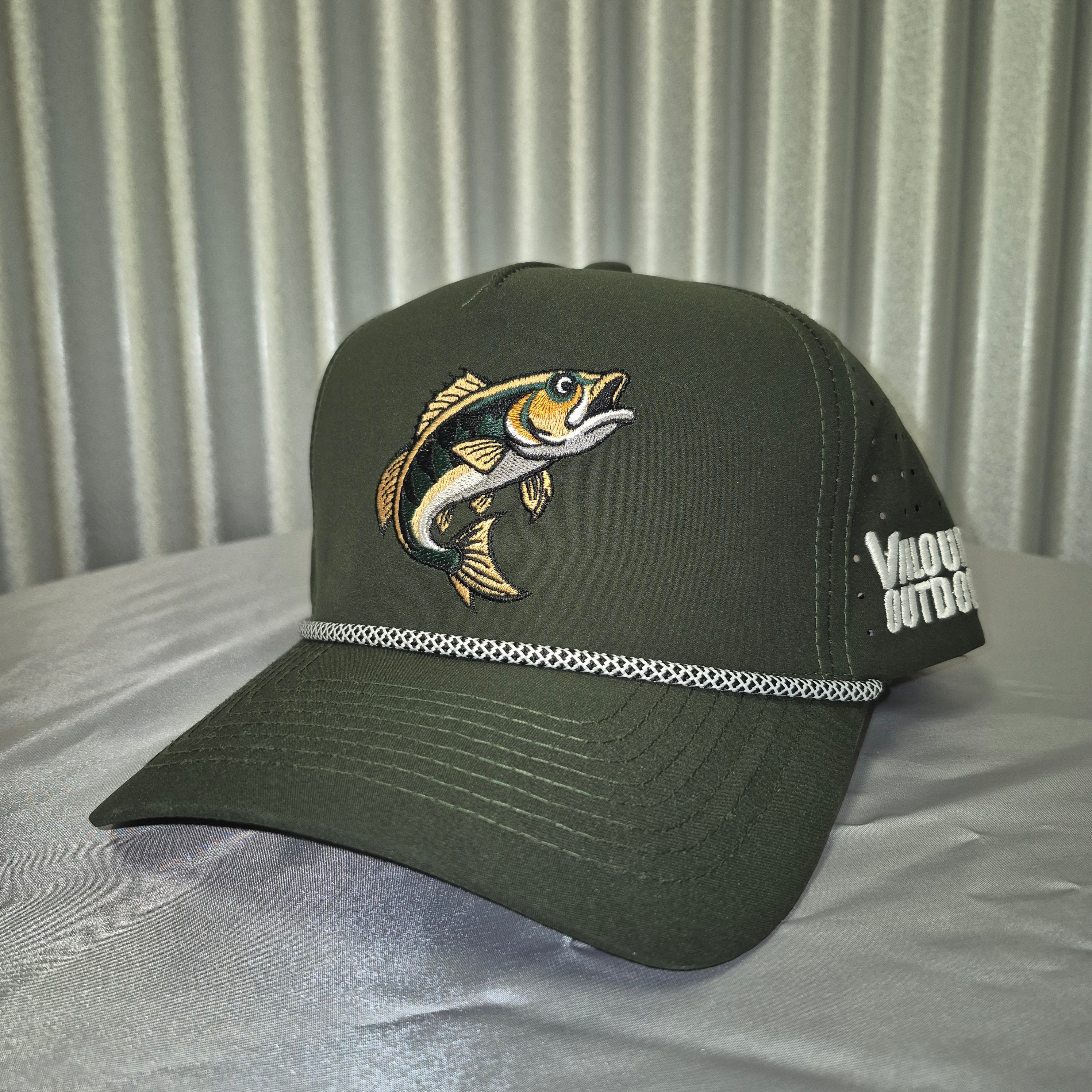 Green cap with fish embroidery on a metallic surface