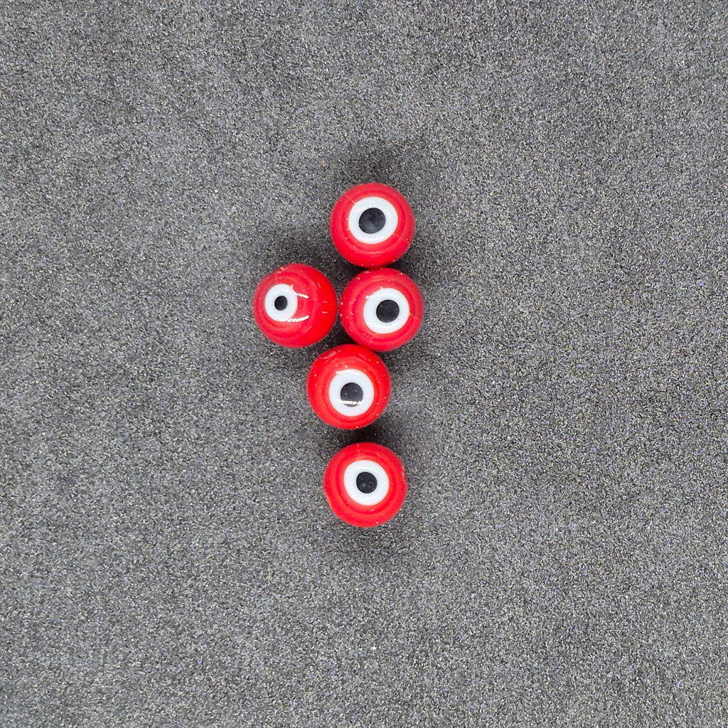 Red Perch Eye Glass Fishing Beads on Black Background