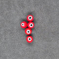 Red Perch Eye Glass Fishing Beads on Black Background