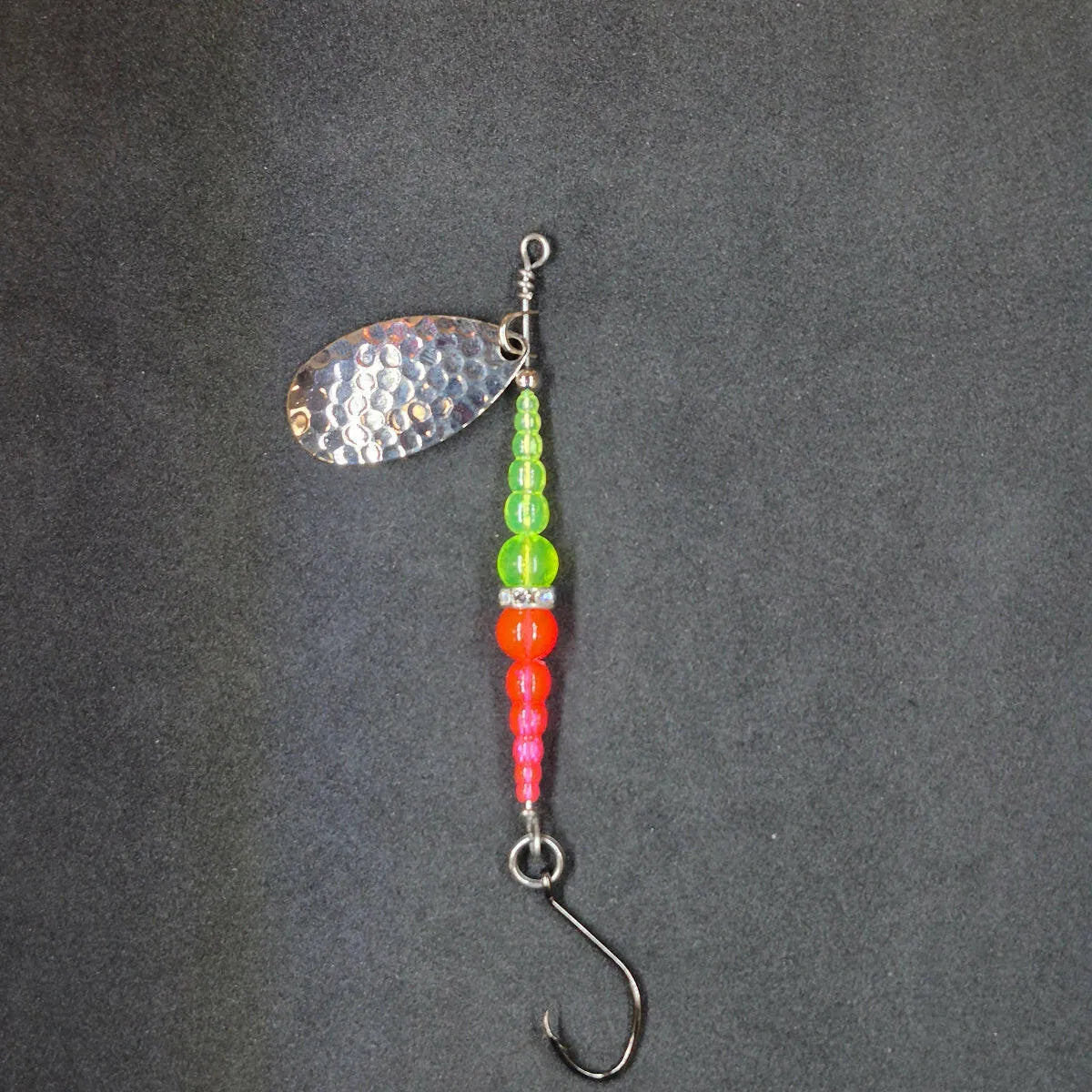 Spitfire Fishing Supermarine MK2 Wedding Ring Spinners on black background chartreuse, pink, nickel blade