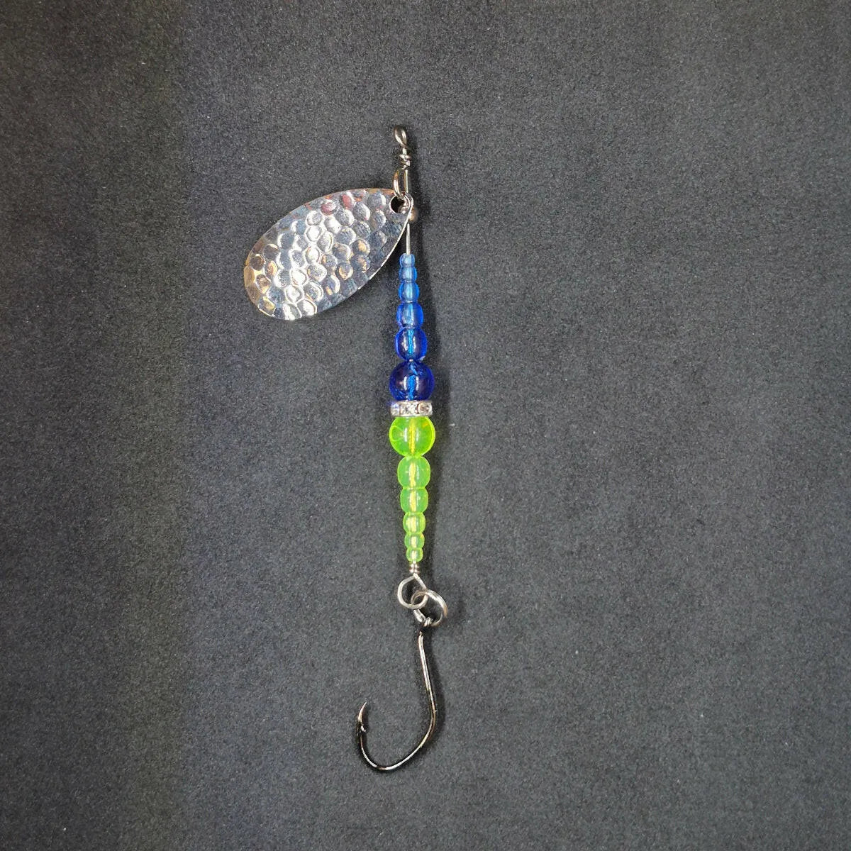 Spitfire Fishing Supermarine MK2 Wedding Ring Spinners on black background blue, chartreuse, nickel blade