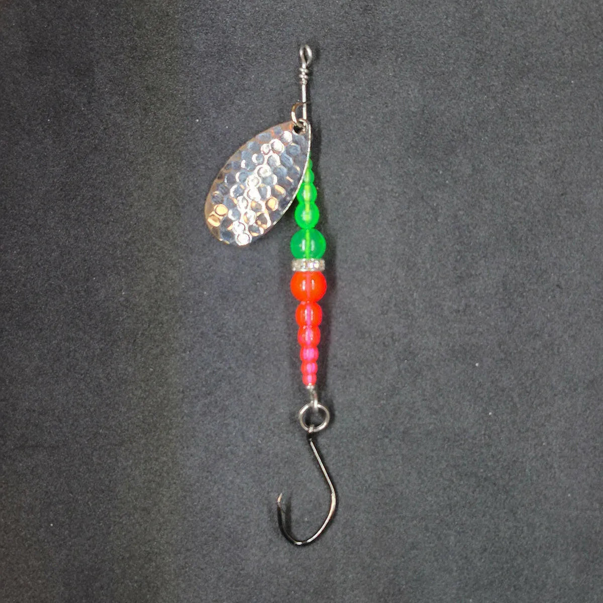 Spitfire Fishing Supermarine MK2 Wedding Ring Spinners on black background green, orange, nickel blade