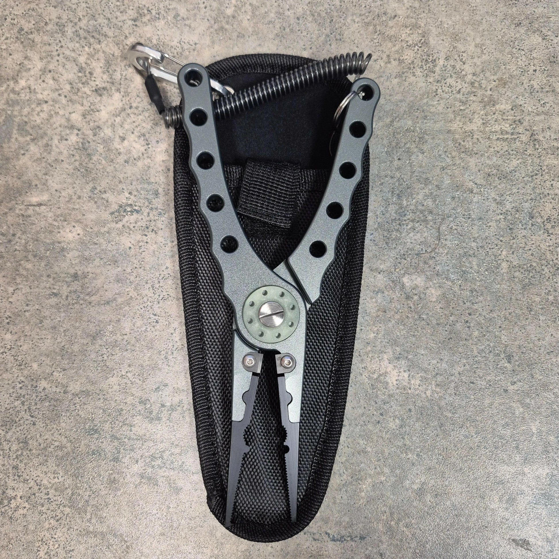 Aluminum Fishing pliers on grey background