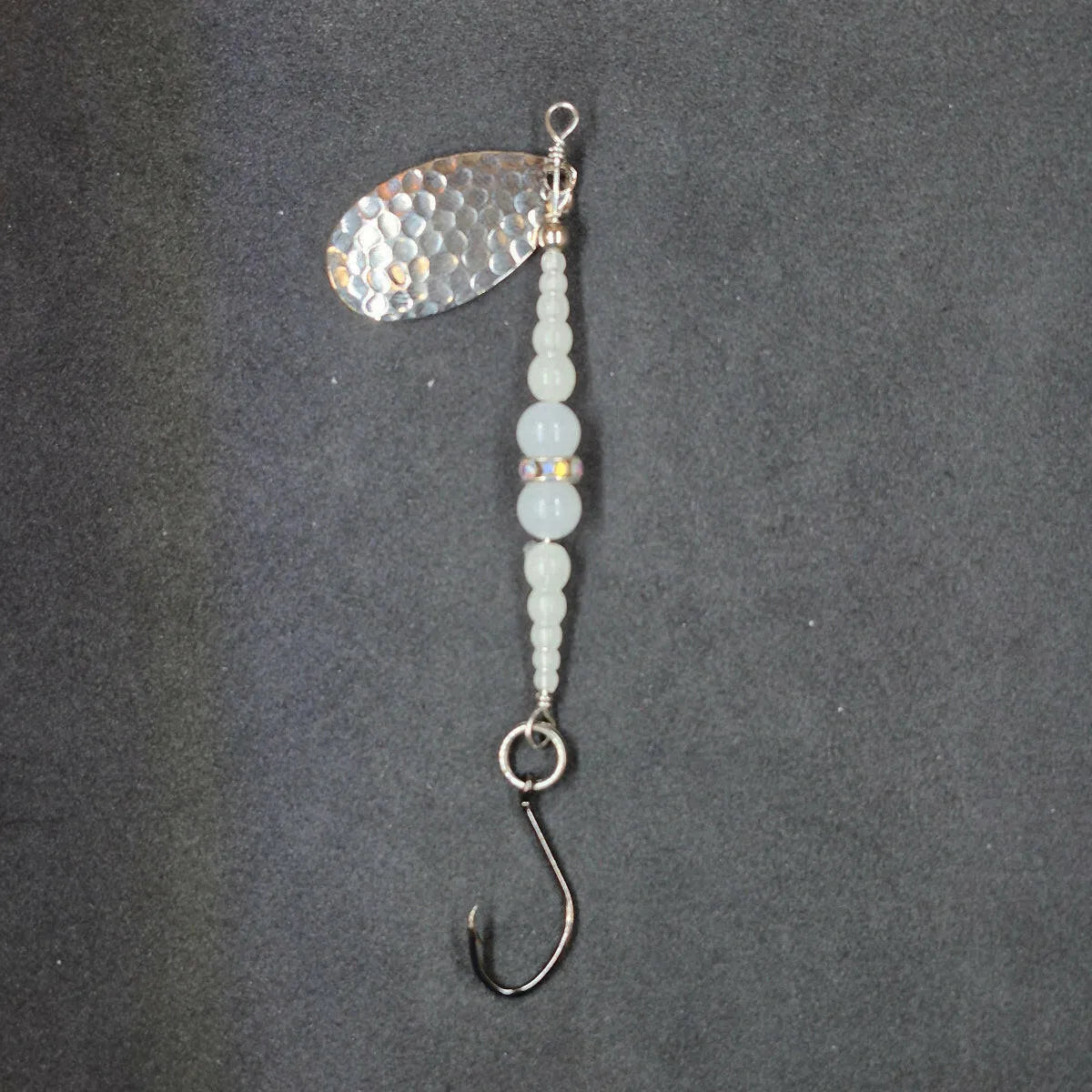 Spitfire Fishing Supermarine MK2 Wedding Ring Spinners on black background glow, glow, nickel blade