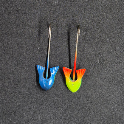 Two colorful fishing jig heads on black background 