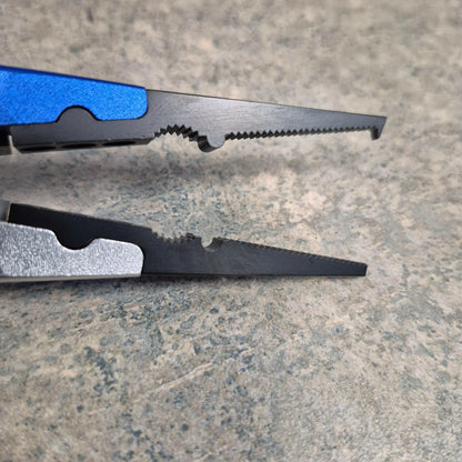 Fishing pliers showing split shot crimper and split ring plier on grey background