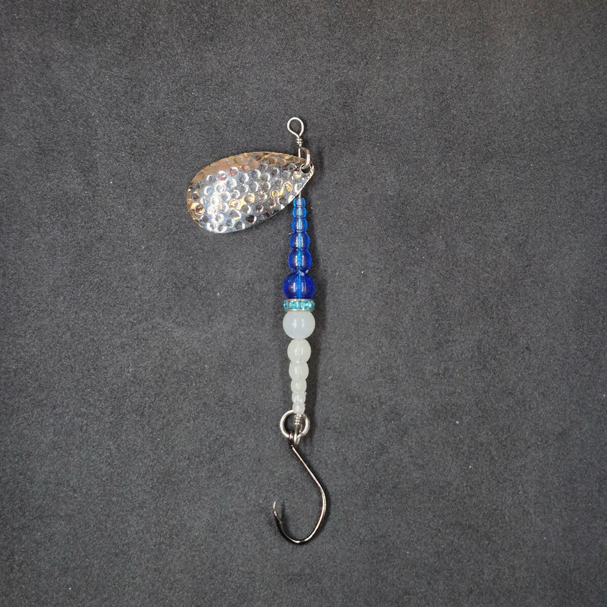 Spitfire Fishing Supermarine MK2 Wedding Ring Spinners on black background blue, glow, nickel blade