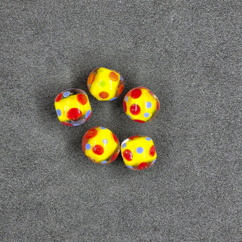 Yellow Glass Fishing Beads on Black Background
