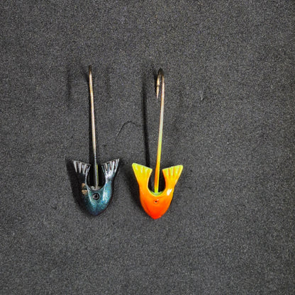 Two colorful fishing jig heads on black background 